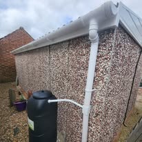 Bright white fascia and downpipe after cleaning