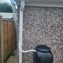 Close up of a clean white downpipe
